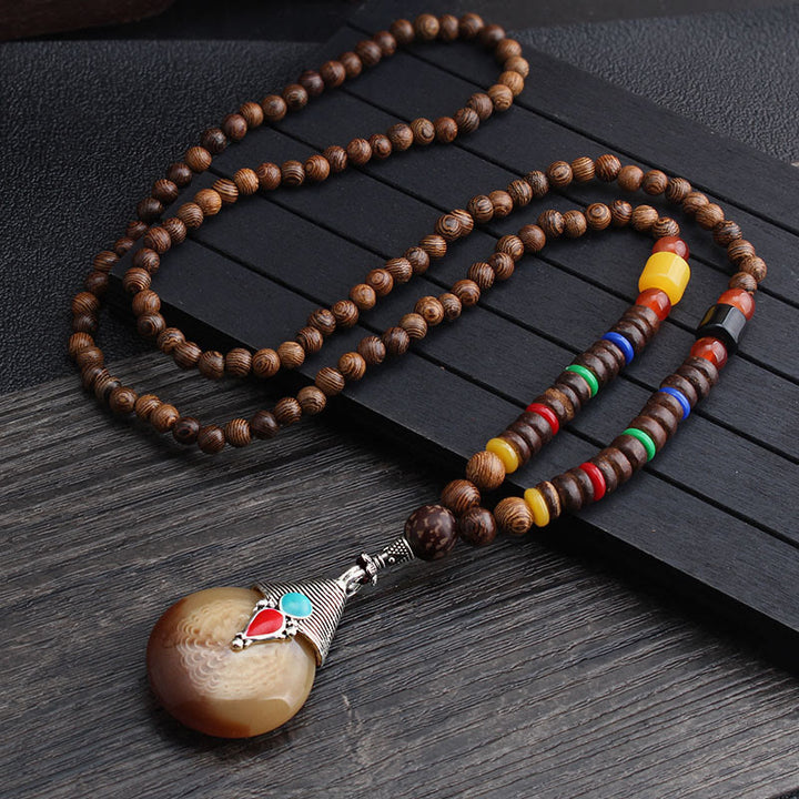 Buddha Stones, colgante de collar de paz de equilibrio de ágata de semilla Bodhi de madera de wengué tibetano