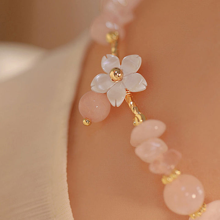 Pulsera de amor con flor de cristal rosa natural chapada en oro de 14 quilates con Buddha Stones