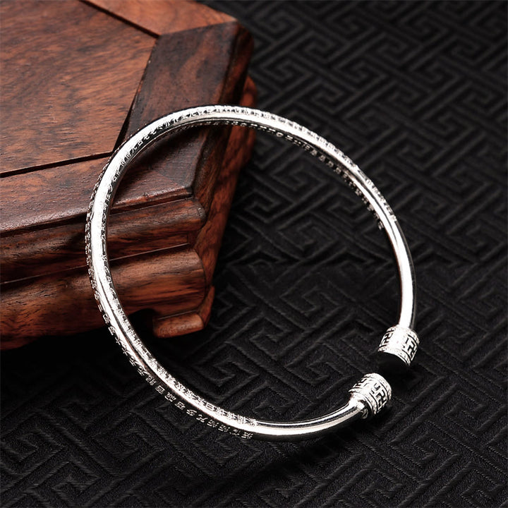Brazalete de cobre blanco con diseño de esvástica grabado en Sutra del corazón