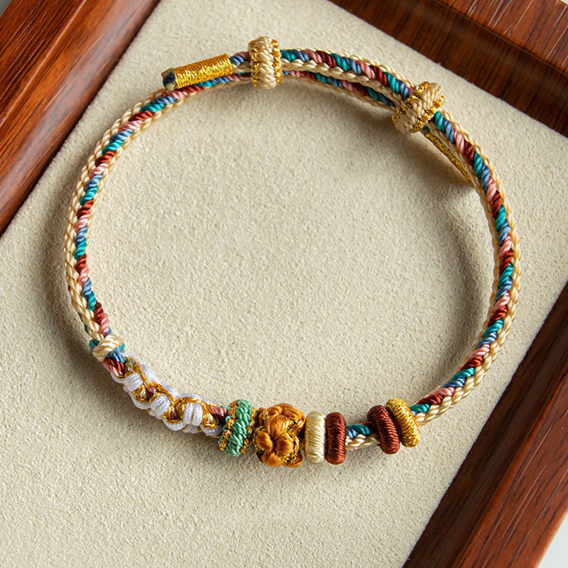Pulsera de hilo trenzado con diseño de flor de melocotón de color Dunhuang hecha a mano con Buddha Stones