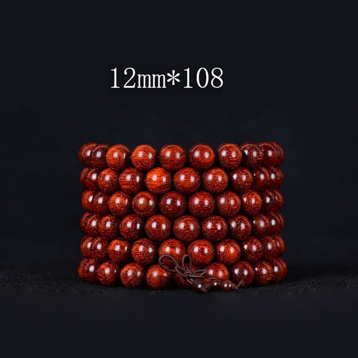 Pulsera de equilibrio de sándalo rojo con hoja pequeña tibetana de Buddha Stones