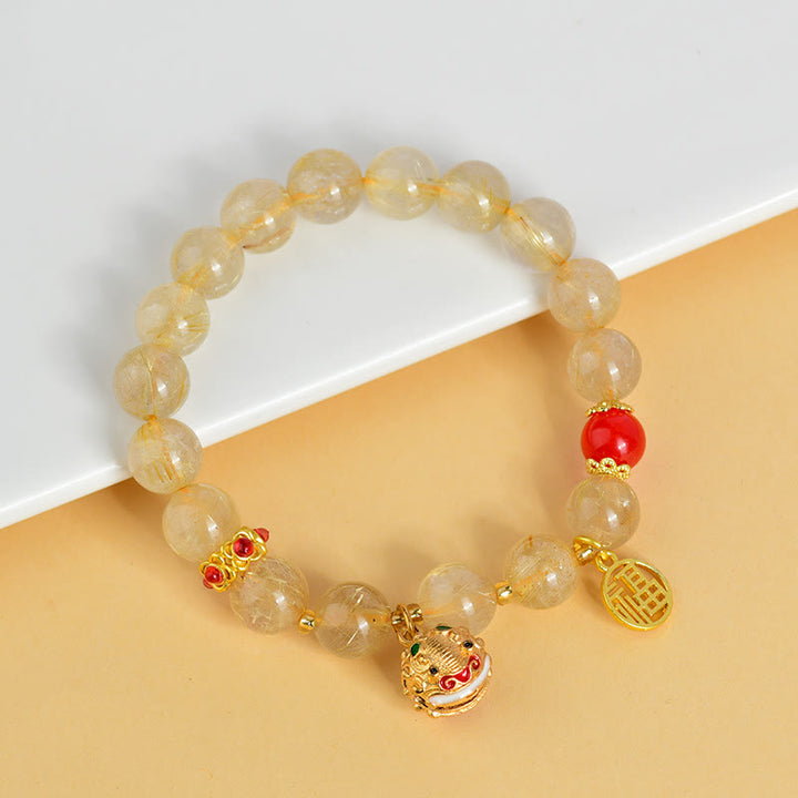 Pulsera de riqueza de campana con dije de personaje Fu de cuarzo rutilado dorado natural con Buddha Stones