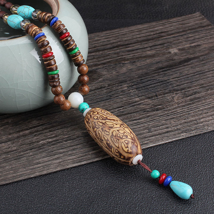 Buddha Stones, colgante de collar de paz de equilibrio de ágata de semilla Bodhi de madera de wengué tibetano