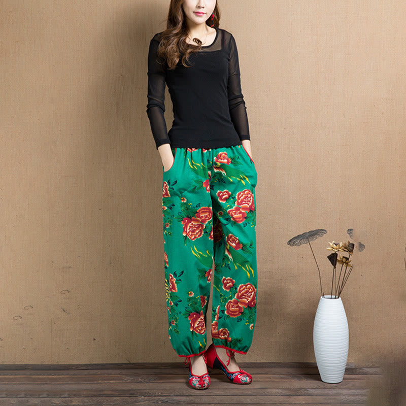 Pantalones bombachos con estampado de flores rojas y verdes de estilo étnico con Buddha Stones y bolsillos
