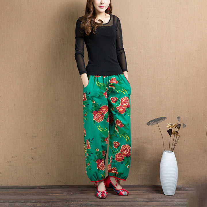 Pantalones bombachos con estampado de flores rojas y verdes de estilo étnico con Buddha Stones y bolsillos