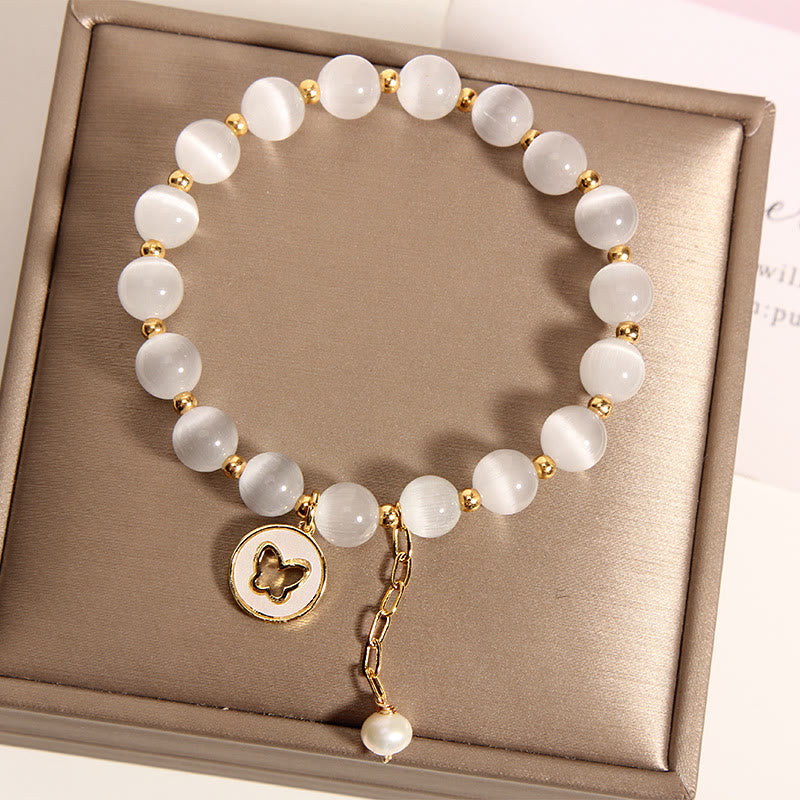 Pulsera de amor con dije de mariposa y ojo de gato con Buddha Stones