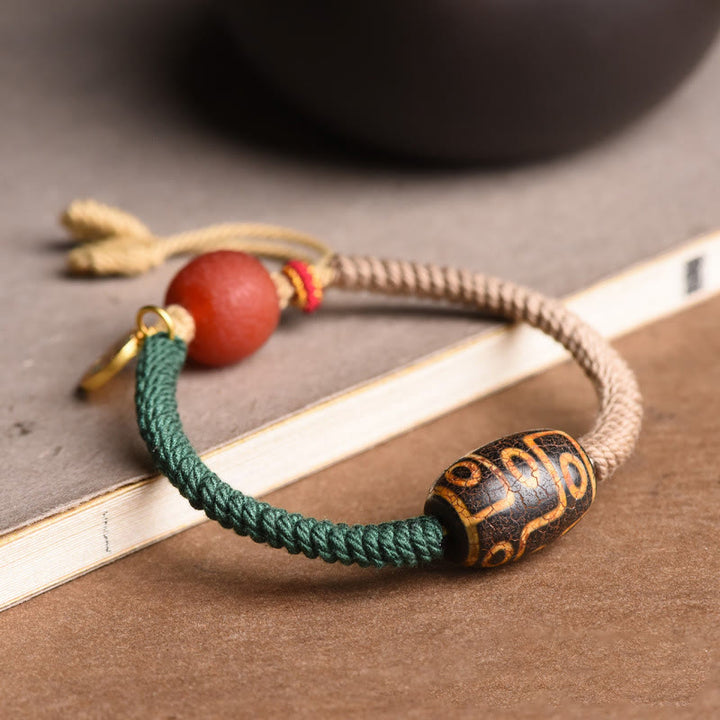 Pulsera de cuerda de riqueza con cuentas Dzi tibetanas de nueve ojos hechas a mano con Buddha Stones