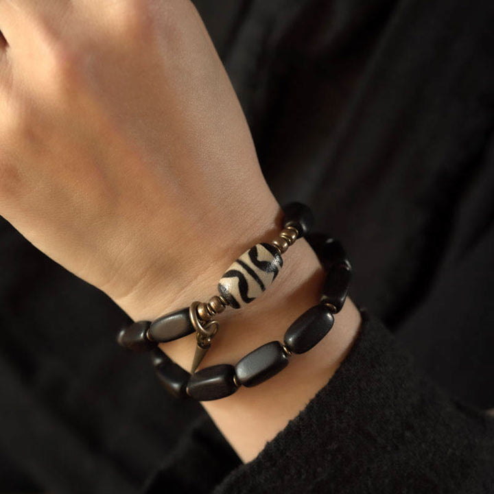 Pulsera de doble envoltura con cuentas Dzi de madera de ébano del Tíbet con Buddha Stones