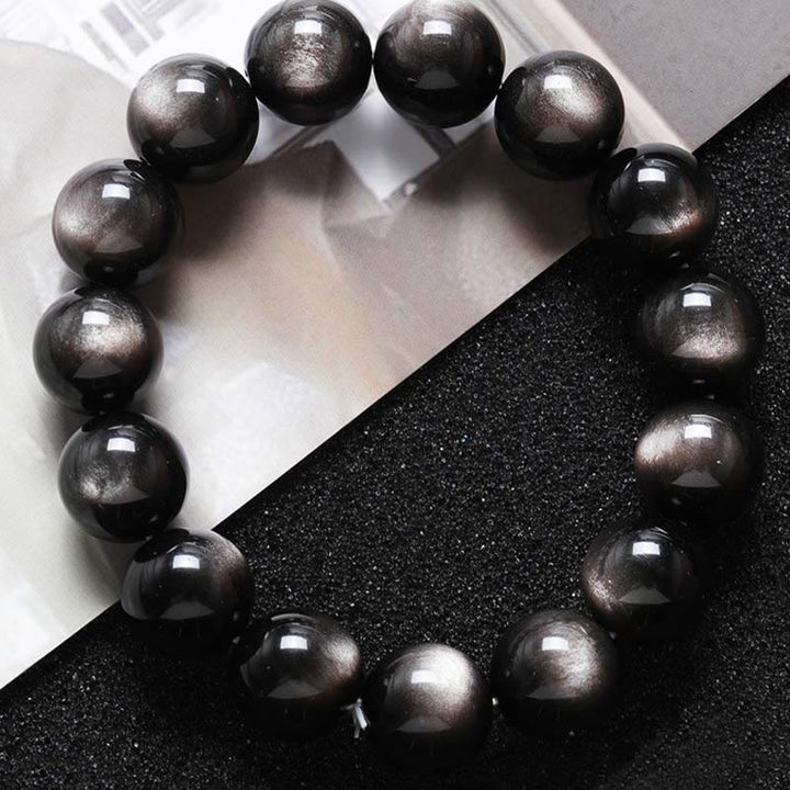 Pulsera de protección calmante de obsidiana brillante de plata natural con Buddha Stones