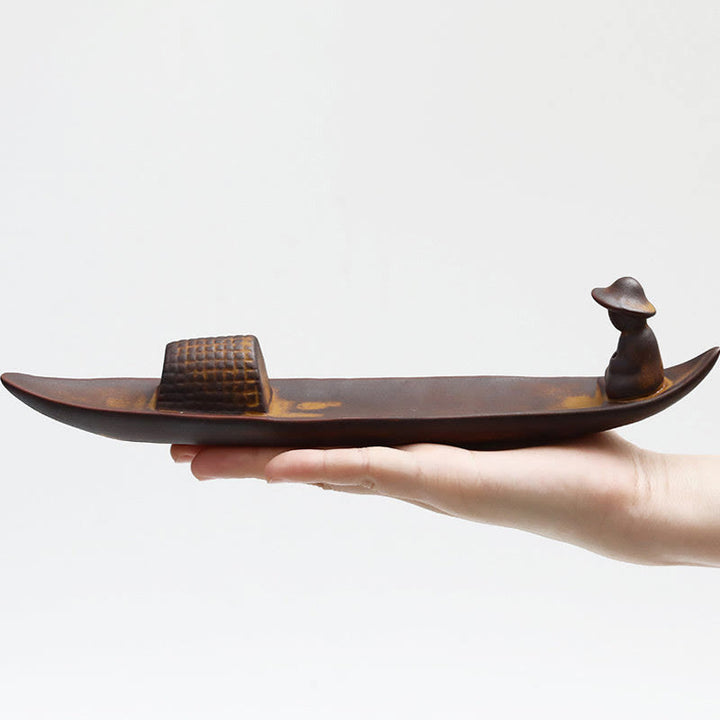 Quemador de incienso curativo de cerámica con Buddha Stones , un pescador solitario a flote