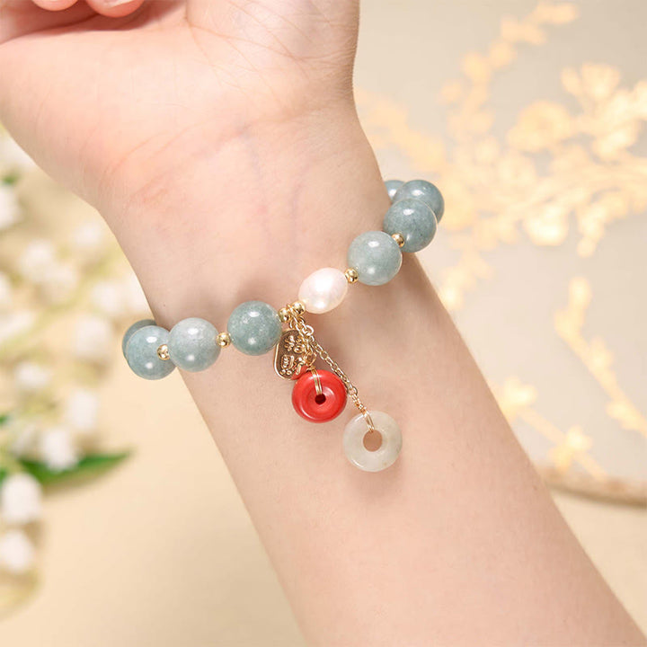 Pulsera de confianza con dije de hebilla de paz y ágata roja de jade con Buddha Stones