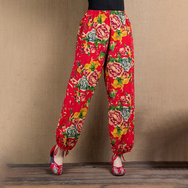 Pantalones bombachos con estampado de flores rojas y verdes de estilo étnico con Buddha Stones y bolsillos
