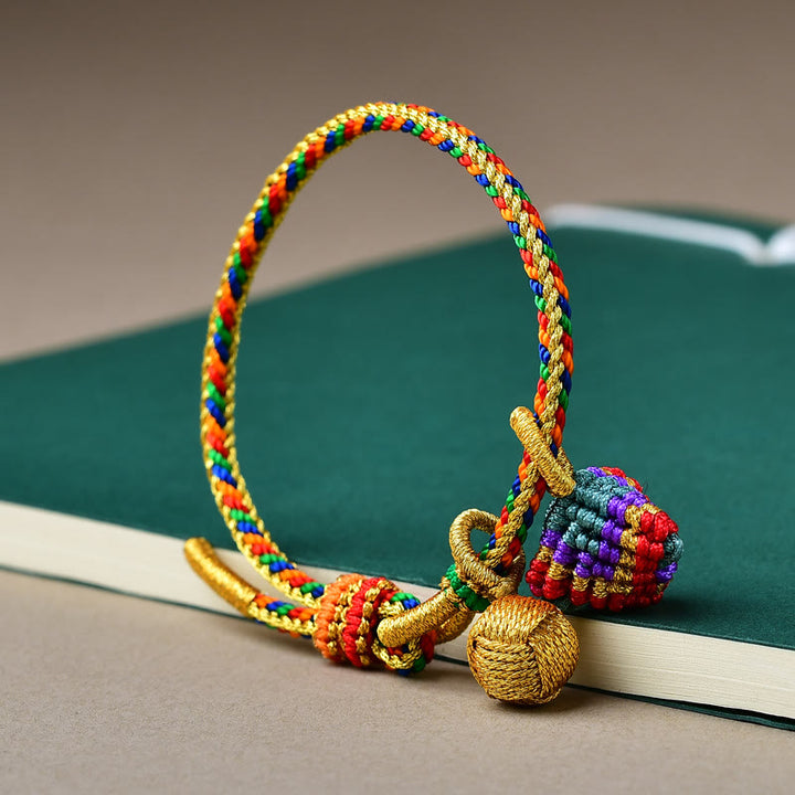 Pulsera con dije de bola dorada Zongzi hecha a mano con cuerda colorida y Buddha Stones