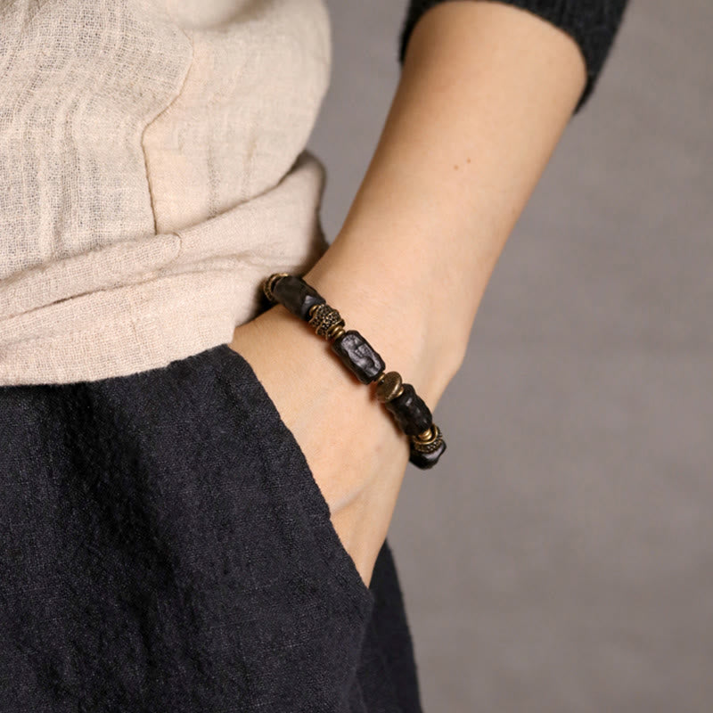Pulsera de paz tranquila de cobre y madera de ébano tibetano con Buddha Stones