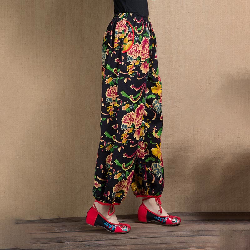 Pantalones bombachos con estampado de flores rojas y verdes de estilo étnico con Buddha Stones y bolsillos