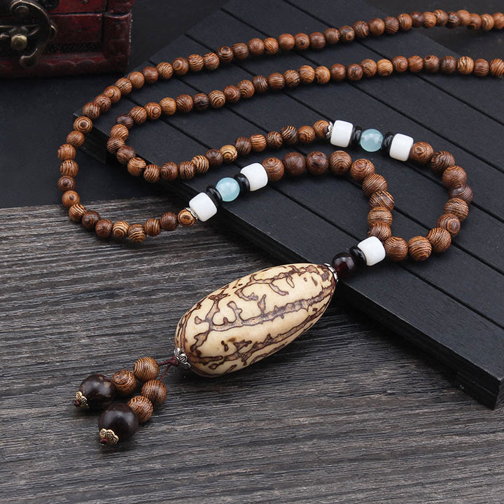 Buddha Stones, colgante de collar de paz de equilibrio de ágata de semilla Bodhi de madera de wengué tibetano