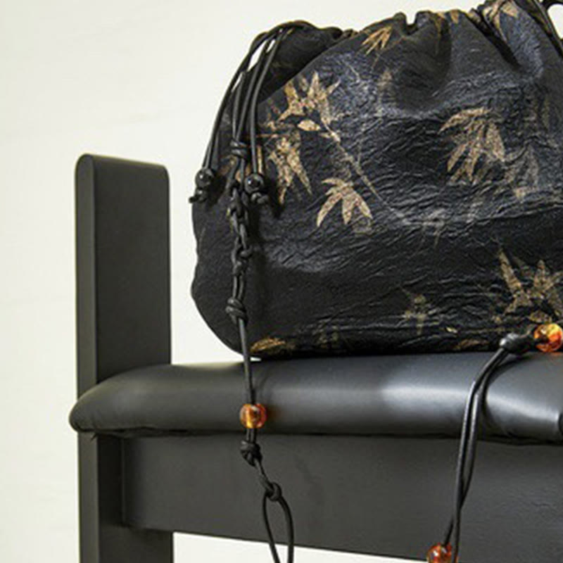Bolso bandolera de acetato con estampado de hojas de bambú amarillo con Buddha Stones