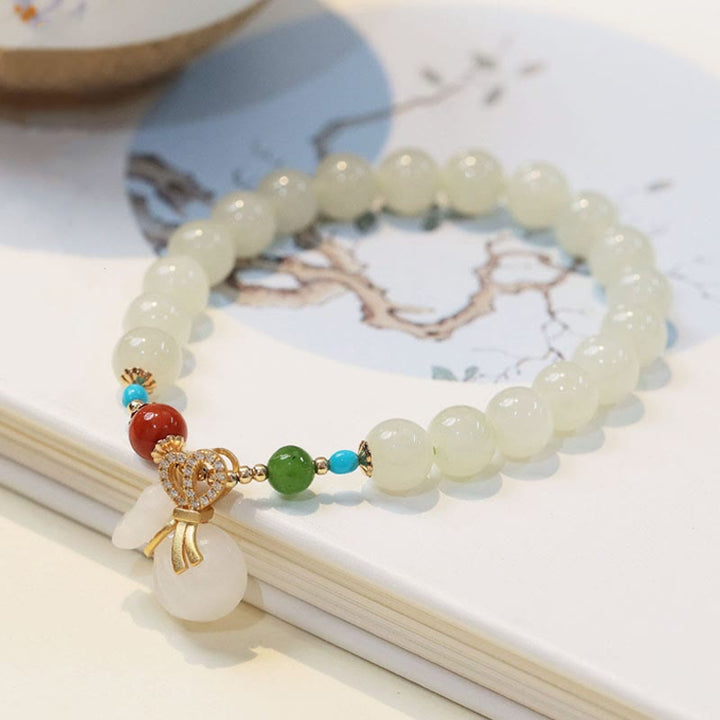 Pulsera de bendición para bolsa de dinero chapada en oro de 14 quilates con jade blanco hetiano natural con Buddha Stones