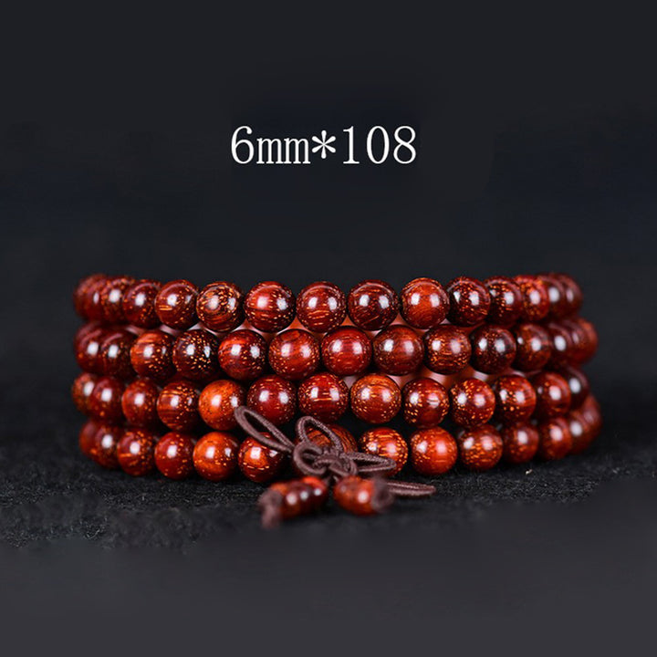 Pulsera de equilibrio de sándalo rojo con hoja pequeña tibetana de Buddha Stones