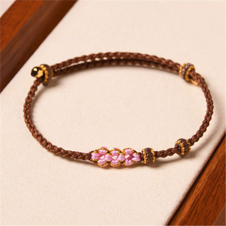 Pulsera de cuerda trenzada con protección de flor de melocotón hecha a mano con Buddha Stones