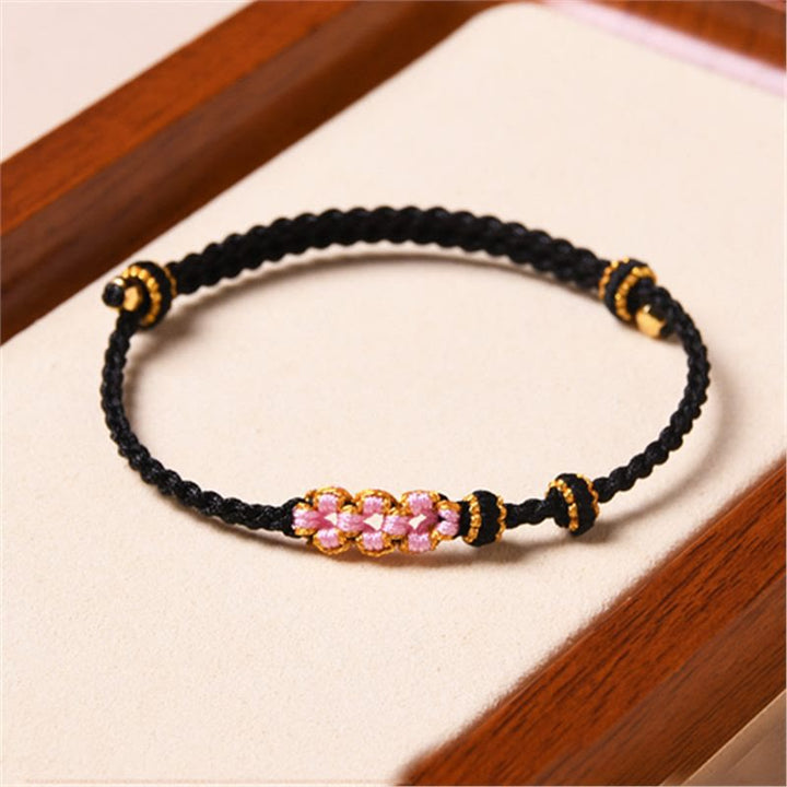 Pulsera de cuerda trenzada con protección de flor de melocotón hecha a mano con Buddha Stones
