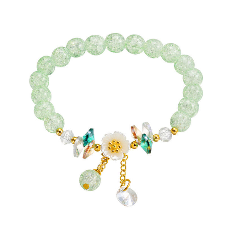 Pulsera de cuentas de cristal con dije de flor de diseño simple con Buddha Stones
