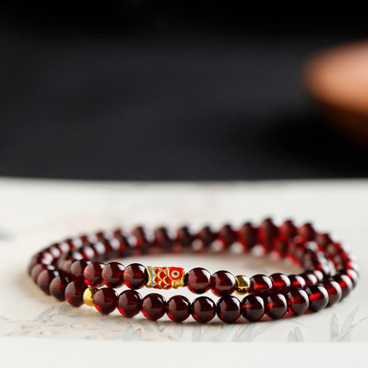 Pulsera de protección con granate natural y pez Koi de oro 999 de Buddha Stones - image 16