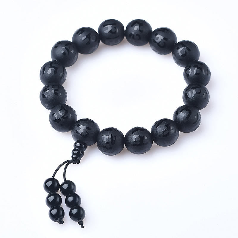 Pulsera de meditación Om Mani Padme Hum de ónix negro y cristal blanco del Tíbet con Buddha Stones