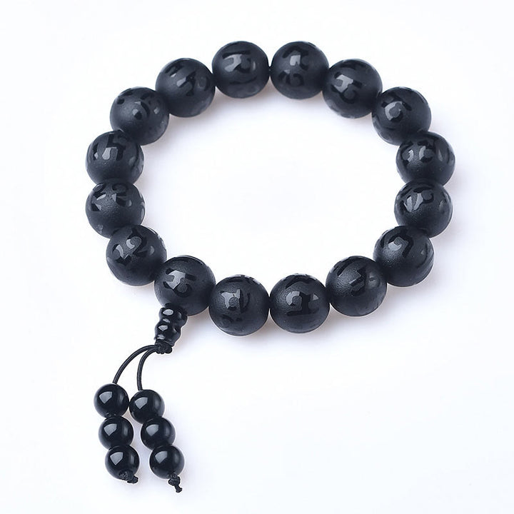 Pulsera de meditación Om Mani Padme Hum de ónix negro y cristal blanco del Tíbet con Buddha Stones