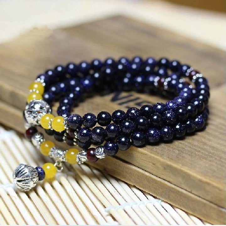 Pulsera con dijes de riqueza de piedra arenisca azul de piedras de Buddha Stones Mala