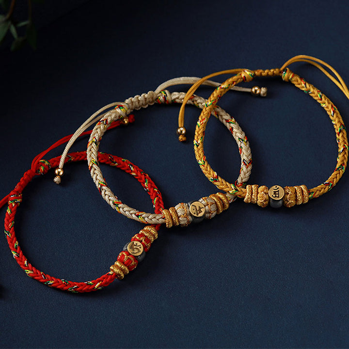 Pulsera de hilo trenzado de la suerte de plata con Buda natal del zodiaco chino de Buddha Stones