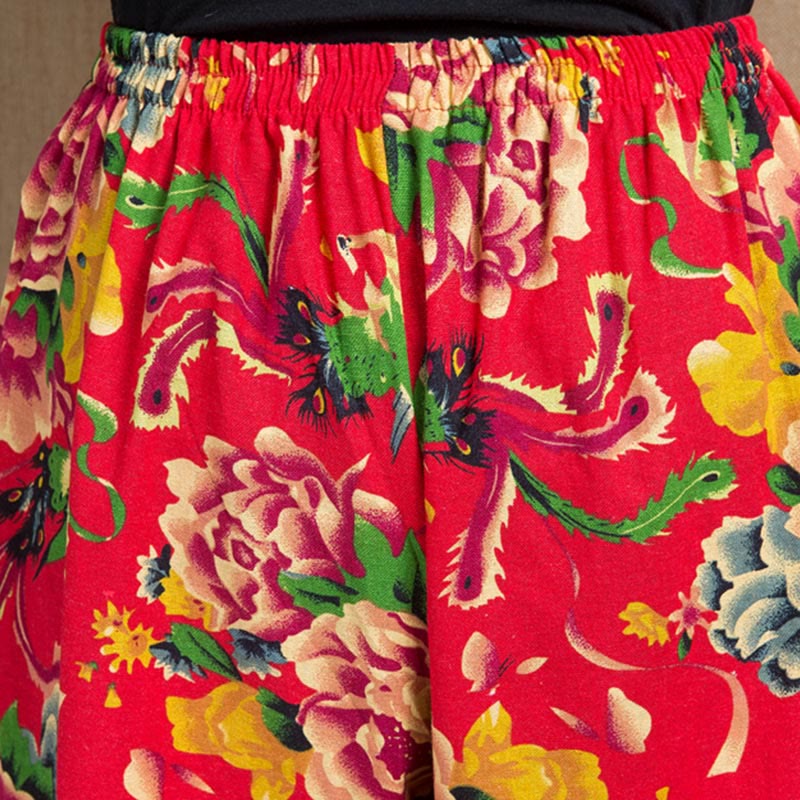Pantalones bombachos con estampado de flores rojas y verdes de estilo étnico con Buddha Stones y bolsillos