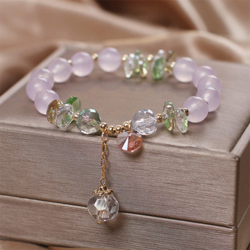 Pulsera con dije de paz y cristal rosa con ojo de gato y Buddha Stones