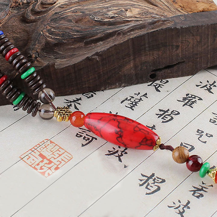 Buddha Stones Madera de wengué Piedra turquesa Protección Calma Collar Colgante