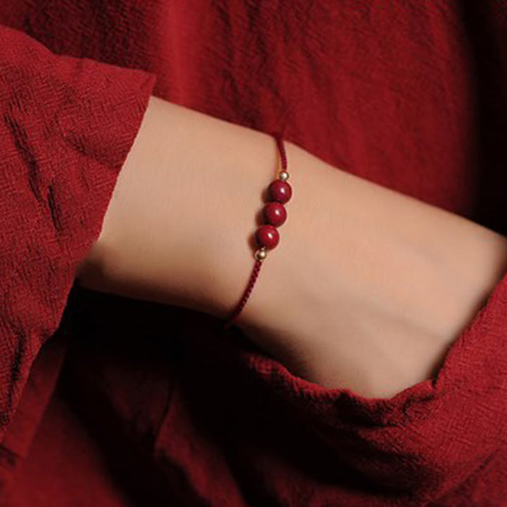 Pulsera trenzada con cadena de bendición de cinabrio natural chapada en oro de 14 quilates con Buddha Stones