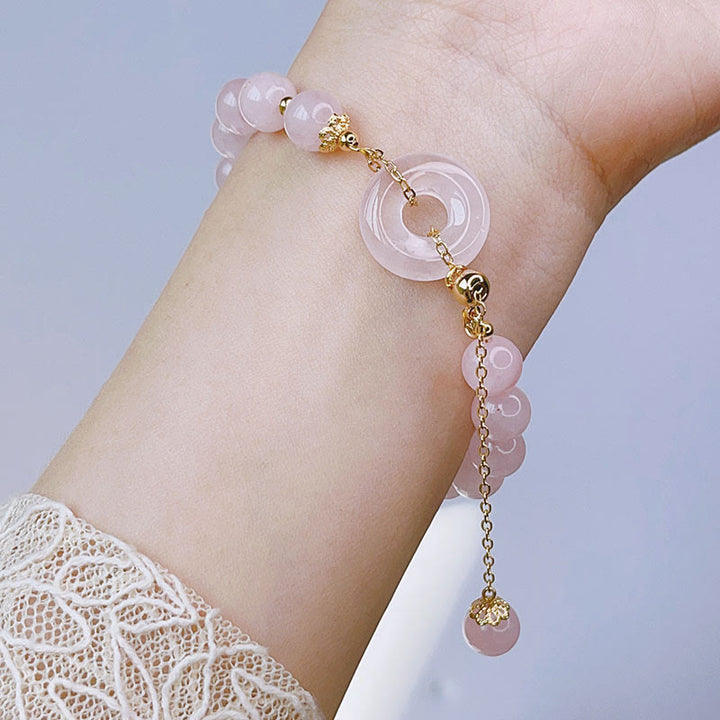 Pulsera con dije de amor con hebilla de paz y cristal rosa natural con Buddha Stones