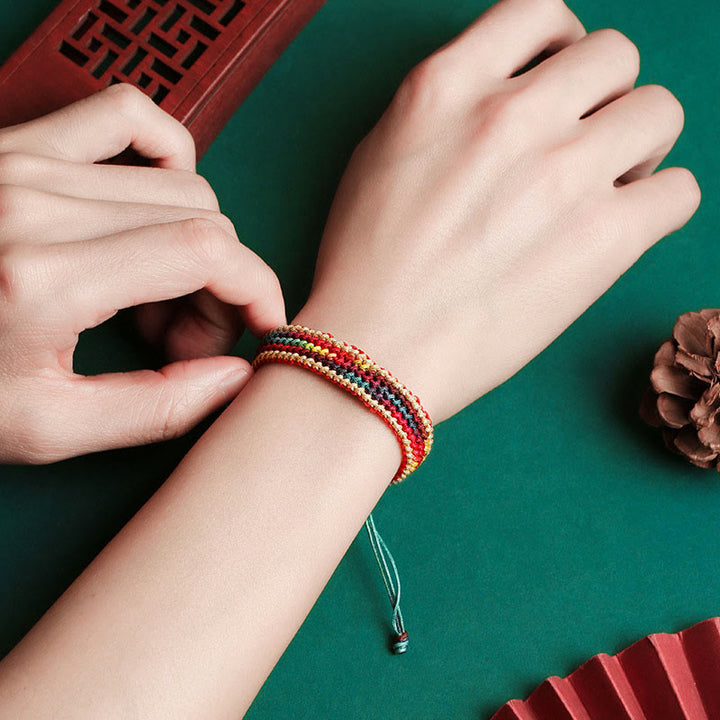 Pulsera de hilo trenzado con protección multicolor de arcoíris hecha a mano con Buddha Stones del Tíbet