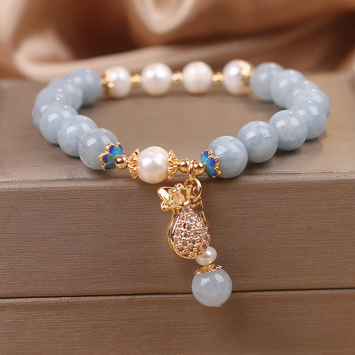 Pulsera con dije para bolsa de dinero con perlas de aguamarina y Buddha Stones