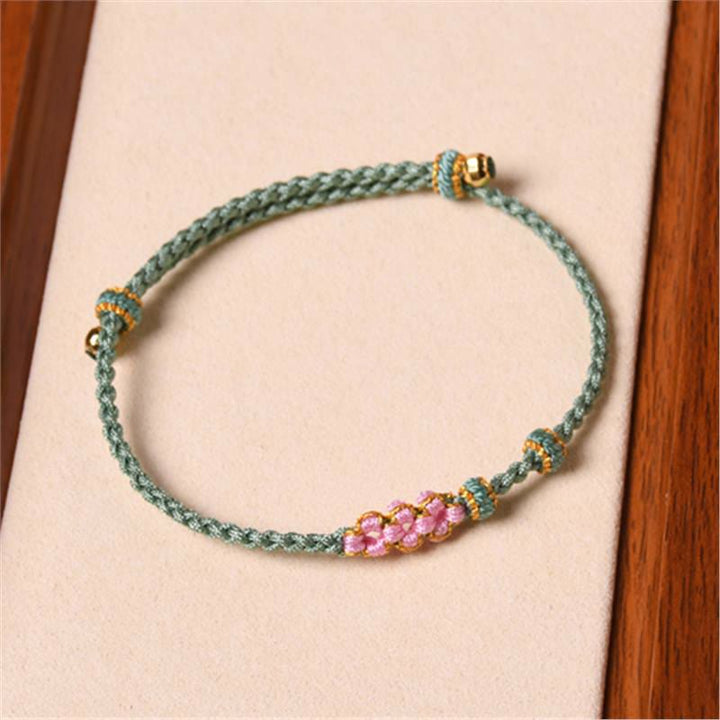 Pulsera de cuerda trenzada con protección de flor de melocotón hecha a mano con Buddha Stones