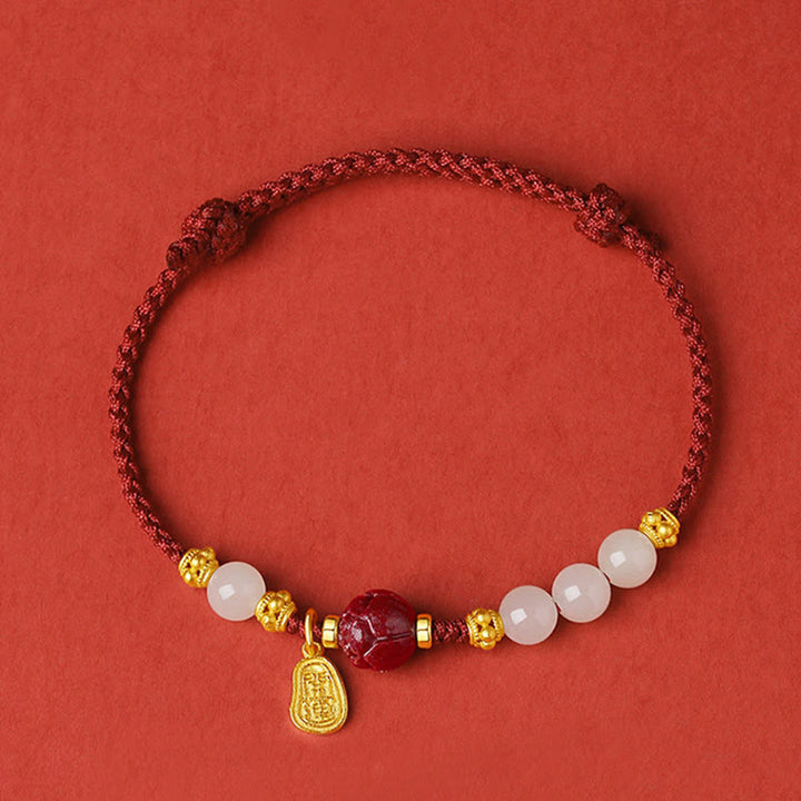 Pulsera de cuerda de la suerte de loto con cinabrio de jade blanco hetiano chapado en oro de 24 Buddha Stones