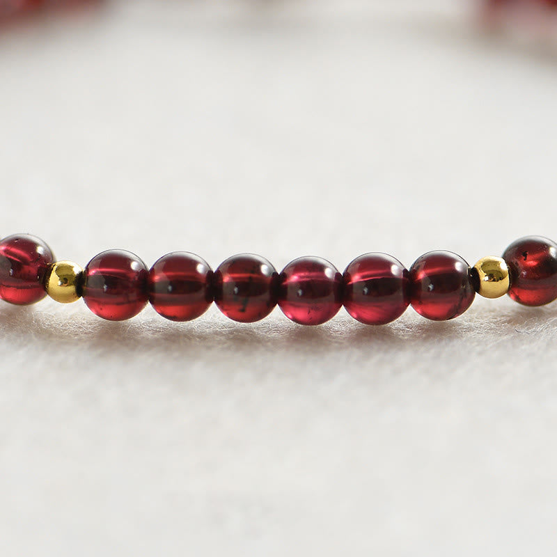 Pulsera de estabilidad con cuentas doradas y granate natural con Buddha Stones