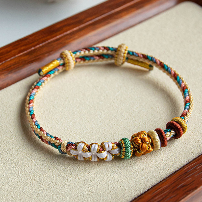 Pulsera de hilo trenzado con diseño de flor de melocotón de color Dunhuang hecha a mano con Buddha Stones