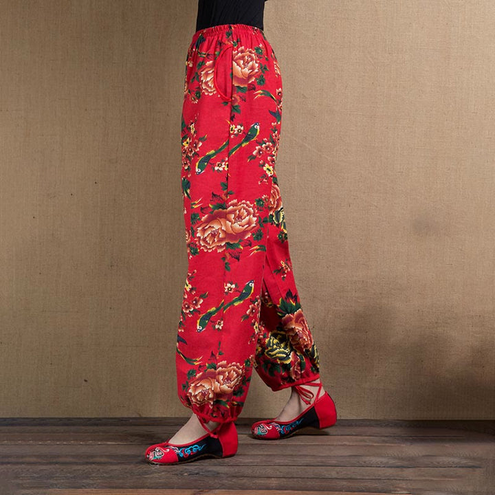 Pantalones bombachos con estampado de flores rojas y verdes de estilo étnico con Buddha Stones y bolsillos
