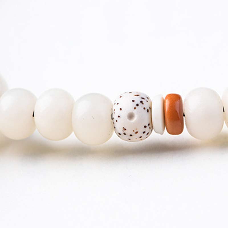 Pulsera de bendición de loto Bodhi de jade blanco tibetano con Buddha Stones