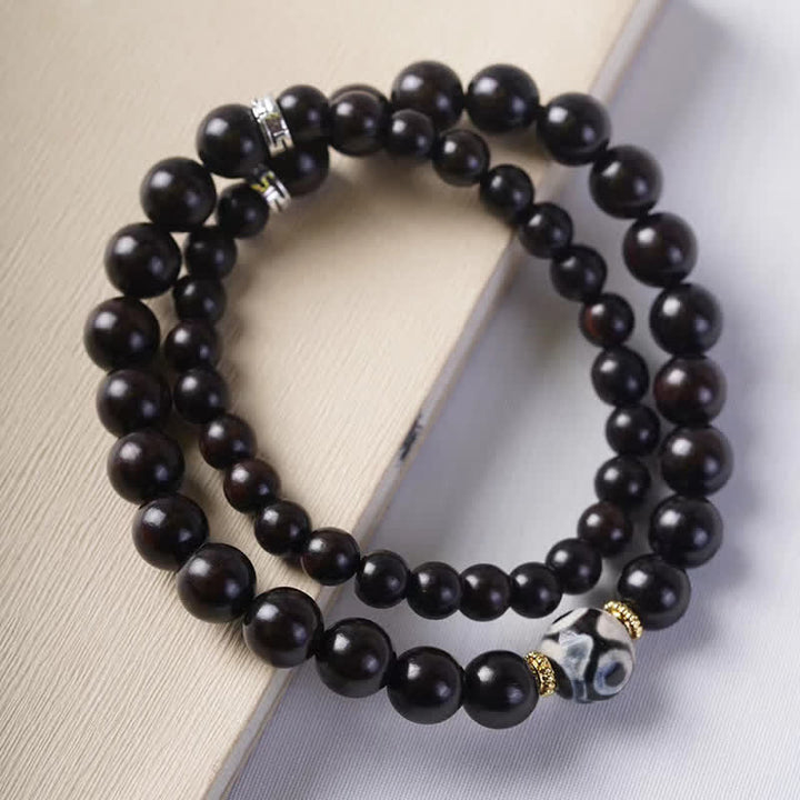 Pulsera de doble envoltura con cuentas Dzi de madera de ébano del Tíbet con Buddha Stones