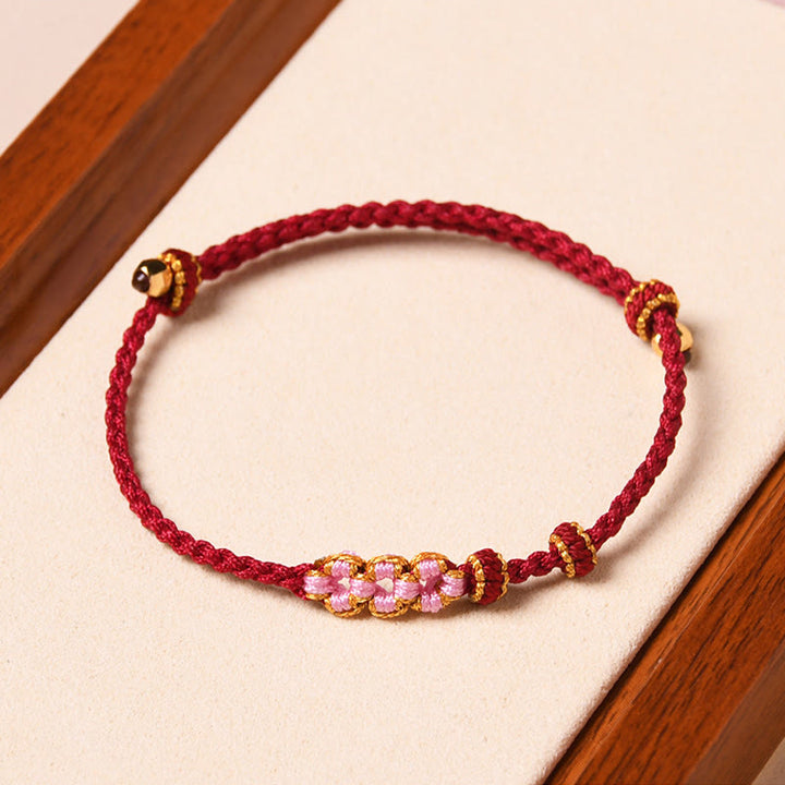 Pulsera de cuerda trenzada con protección de flor de melocotón hecha a mano con Buddha Stones