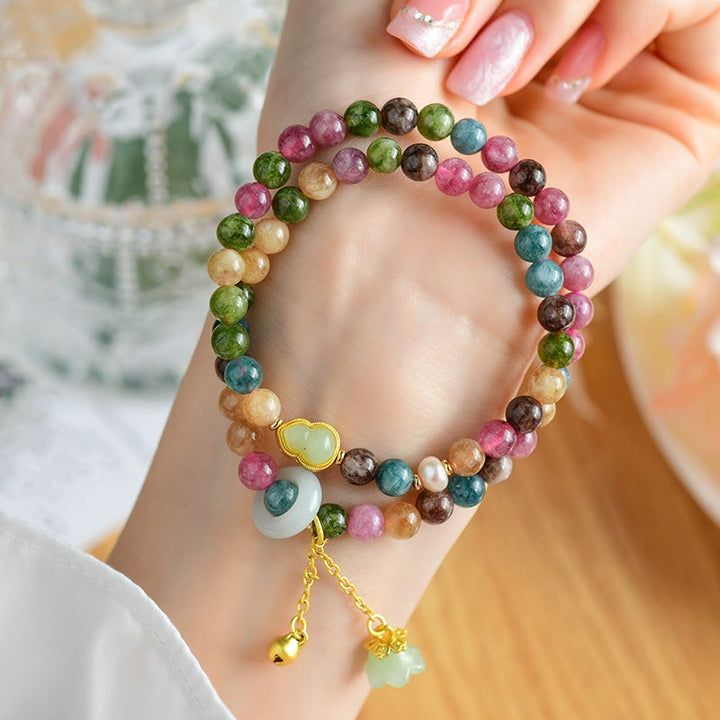 Pulsera con dije de lirio de los valles de doble envoltura de sabiduría de calabaza de turmalina multicolor con Buddha Stones