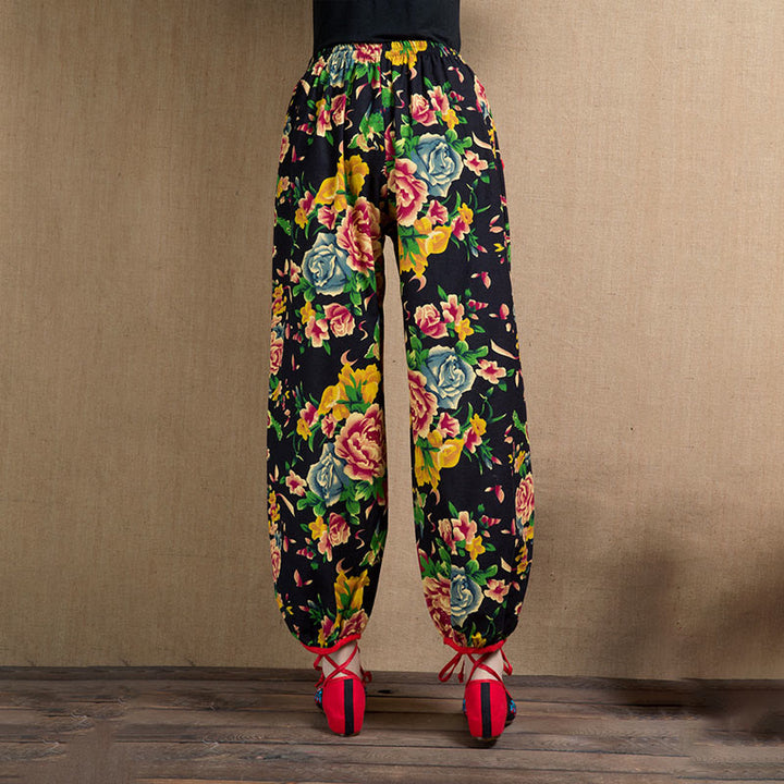 Pantalones bombachos con estampado de flores rojas y verdes de estilo étnico con Buddha Stones y bolsillos