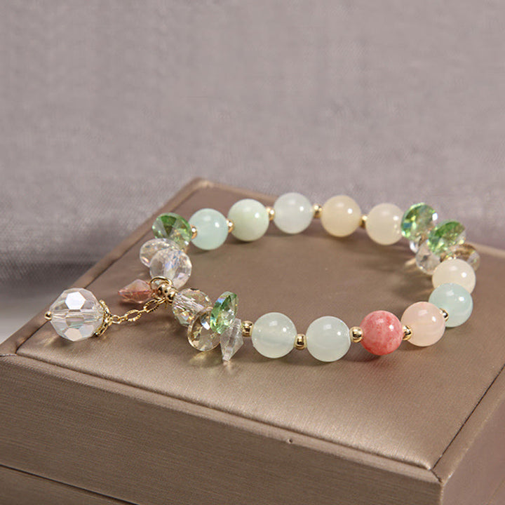 Pulsera con dije de paz y cristal rosa con ojo de gato y Buddha Stones