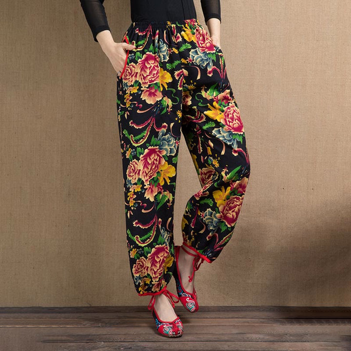 Pantalones bombachos con estampado de flores rojas y verdes de estilo étnico con Buddha Stones y bolsillos